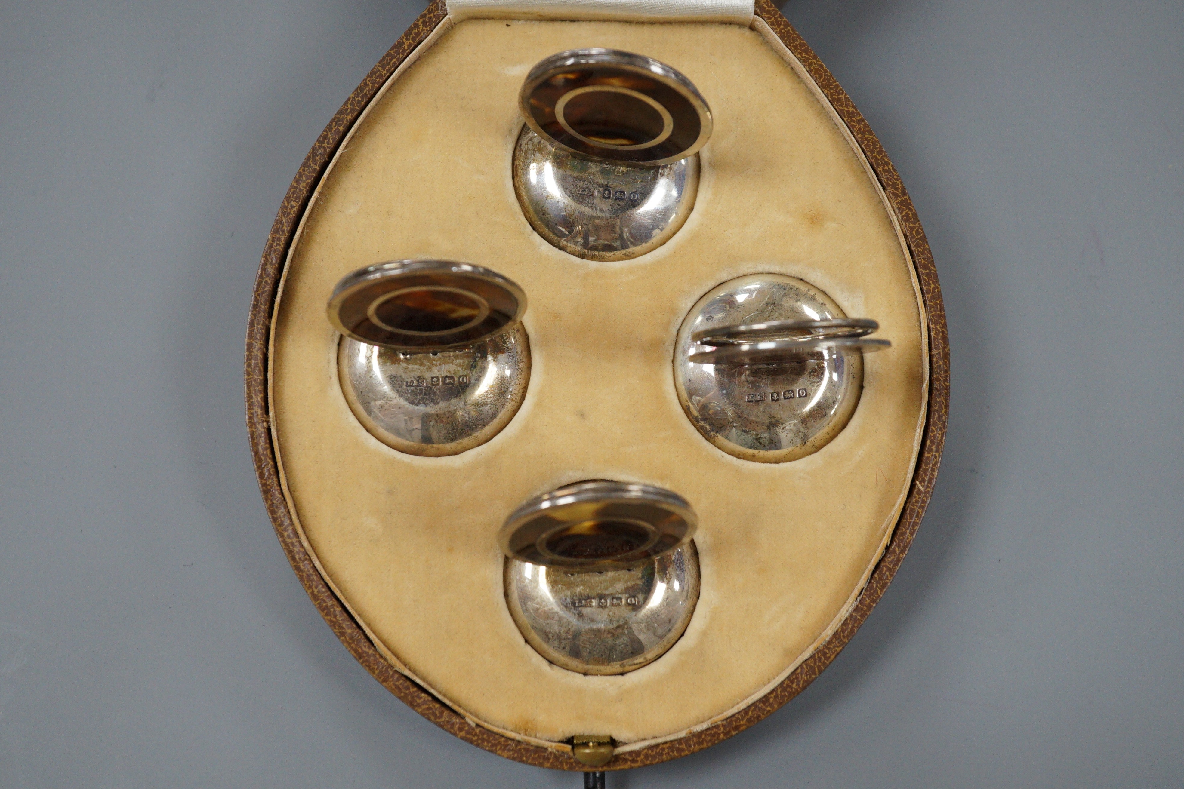 A cased set of George V four silver and tortoiseshell mounted menu holders, Levi & Salaman, Birmingham, 1913, 41mm.